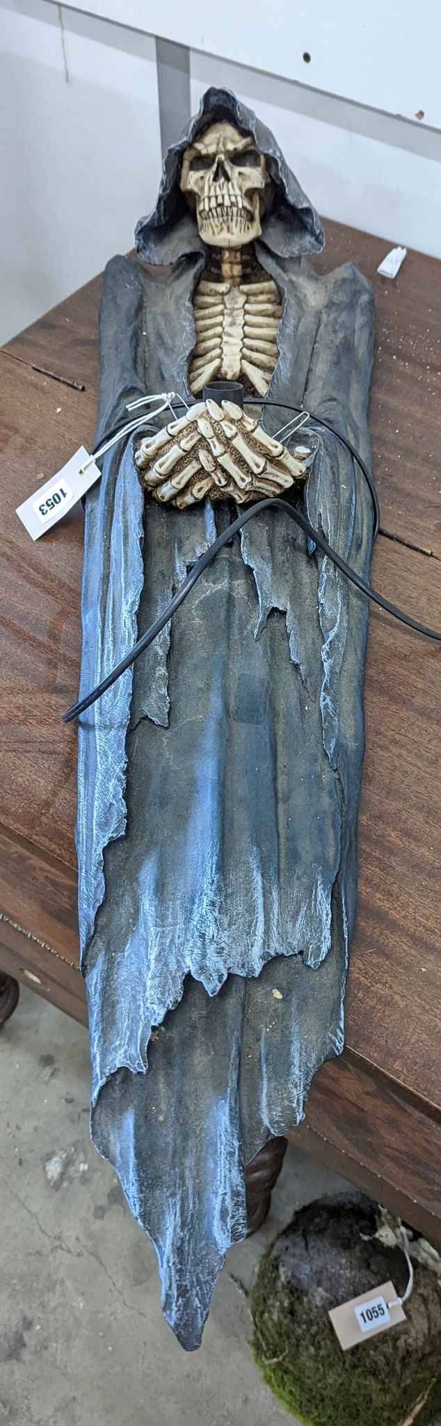 A pair of composition skeleton wall lights, height 85cm
